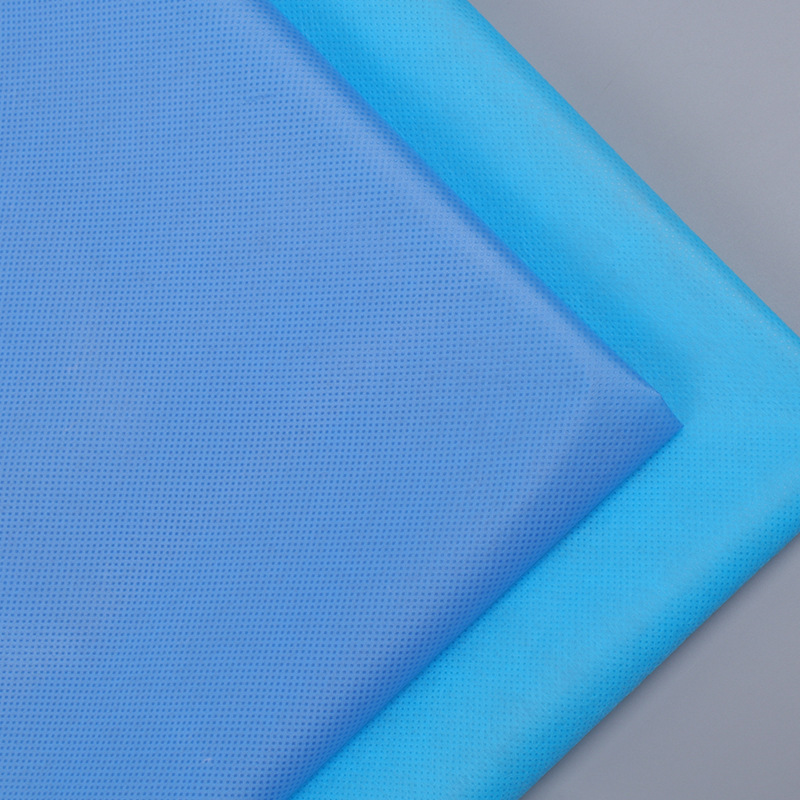 一次性藍色防護服隔離衣淋膜無紡布PP+PE淋膜無紡布淋膜無紡布
